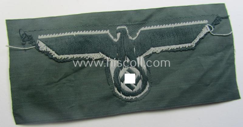 WH (Heeres) early- (ie. pre-war-) period- and/or greyish-coloured breast-eagle of the: 'M36'- (ie. 'M40'-) pattern as was executed in the 'BeVo'-weave pattern on a darker-green-coloured background