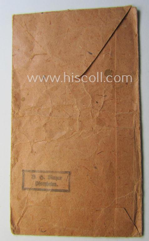 Empty 'Zellstoff'-based pouch as was intended for a medal: 'Winterschlacht im Osten 1941/42' as was produced by the company: 'B.H. Mayer's Kunstprägeanstalt' (ie. 'Hersteller 26')