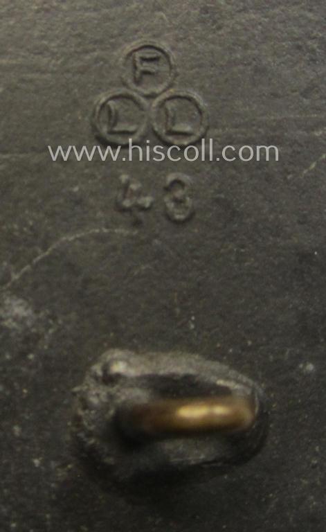 WH (KM) 'Marine-Artillerie-Abzeichen' being a maker- (ie. 'F.L.L. - 43'-) marked- and/or zinc- (ie. 'Feinzink'-) based example by the: 'Friedrich Linden'-company