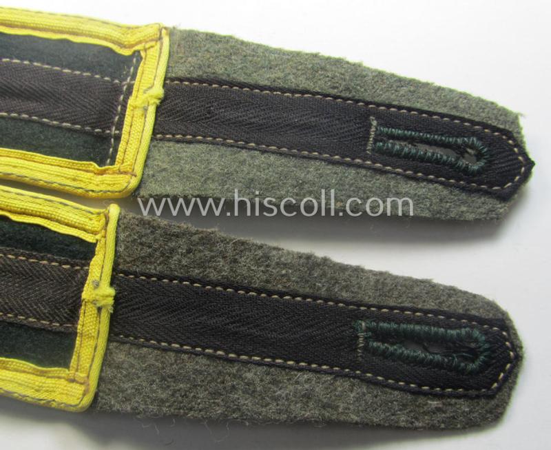 Pair of later-war-period, WH (Heeres) so-called: 'M44'-styled ie. 'simplified', EM-type shoulderstraps (as very unusually executed in darker-green wool!)  as intended for a: 'Soldat eines Nachr.-Rgts. o. Abts.'