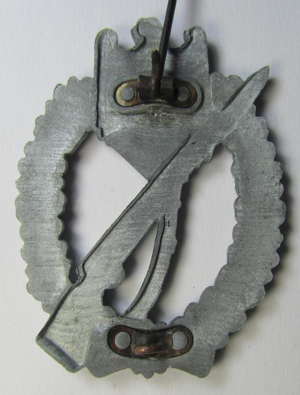 Attractive, 'Infanterie-Sturmabzeichen in Silber' (or: silver-class infantry-assault badge ie. IAB) being a non-maker-marked (zinc-based) so-called: 'four-rivet'-pattern example as was produced by a to date still unidentified maker
