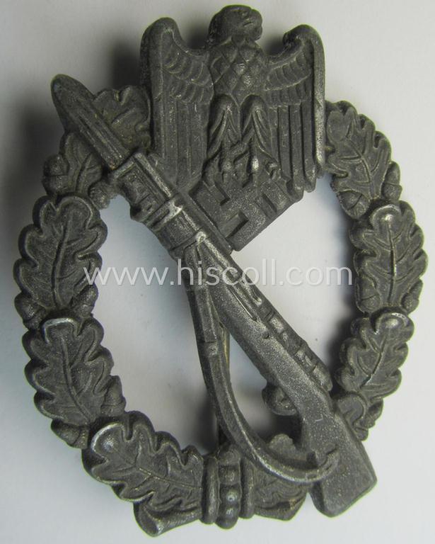 Attractive, 'hollow-back'-pattern 'Infanterie Sturmabzeichen in Silber' (or: silver infantry-assault badge ie. IAB) being a non-maker-marked example as executed in zinc-based metal (ie. 'Feinzink') as was produced by the: 'Wilh. Deumer'-compa...