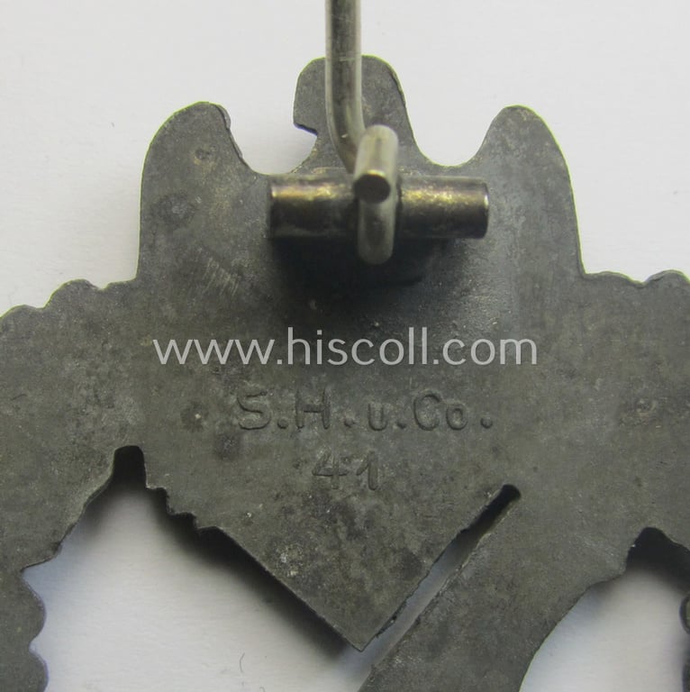 'Infanterie Sturmabzeichen in Silber' (or: silber-class infantry assault-badge ie. IAB) being a maker- (ie. 'S.H.u.C.o. 41'-) marked example as executed in bronze-toned, zinc-based metal (ie. 'Feinzink')