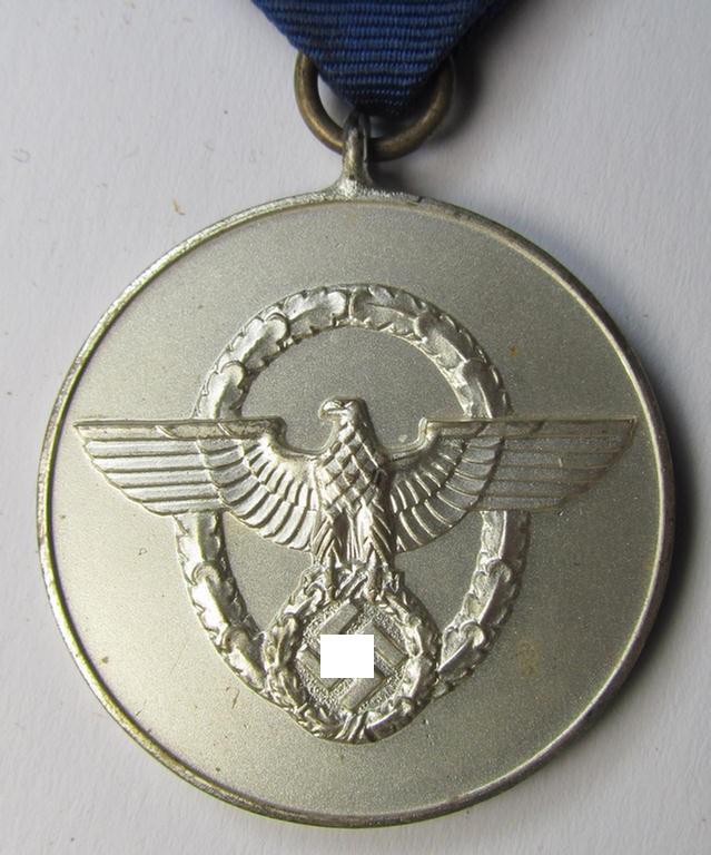 Attractive, bright-silver-toned, so-called: 'Polizei-Dienstauszeichnung 3. Stufe' (or: police loyal-service medal third-class) that comes mounted onto its period ribbon (ie. 'Bandabschnitt')