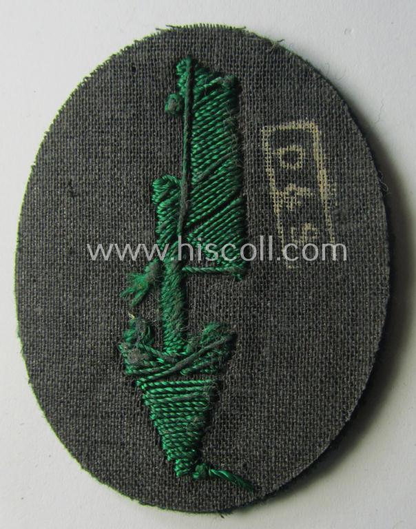 WH (Heeres) trade- and/or special-career-insignia ie. hand-embroidered 'signal-blitz' being a maker- ('D&G'-) marked example as executed in green-coloured linnen as was specifically intended for a soldier within the: 'Jäger- o. Geb.Jäger-Truppen...
