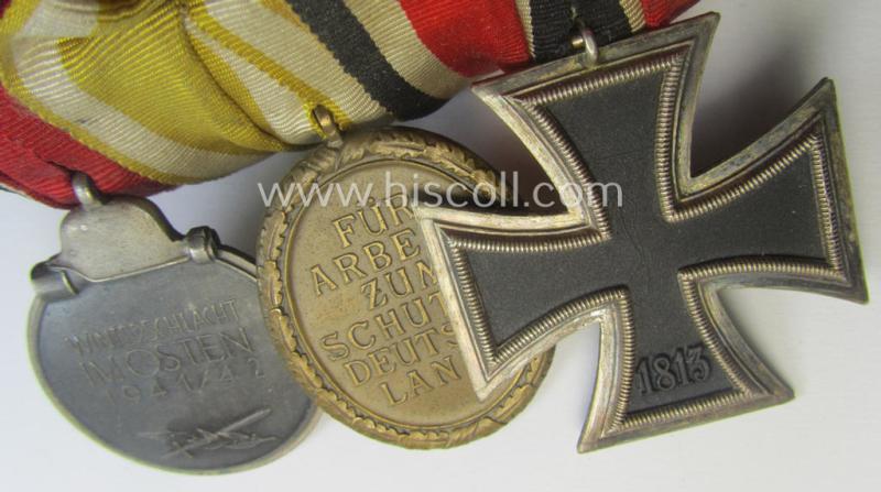 3-pieced, WWII-period medal-bar (ie. 'Ordenspange') showing resp. an: 'EKII.Kl.', a: 'Westwall'-medal and a: 'Medaille Winterschlacht im Osten 1941-42'
