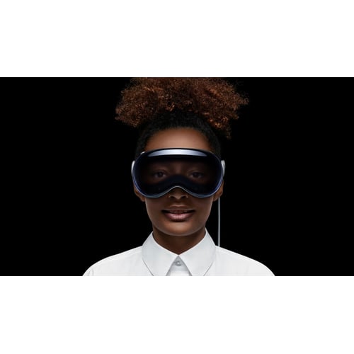 Apple Vision Pro worn by a user showing the front glass design