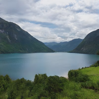 A large body of water surrounded by mountains