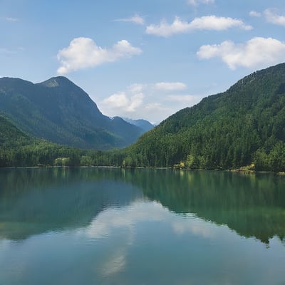 A large body of water surrounded by mountains