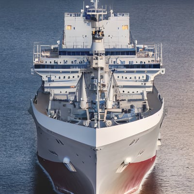 A large white and red ship in the water