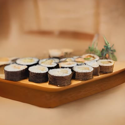 A wooden tray topped with lots of sushi