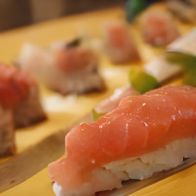 A close up of sushi on a wooden table