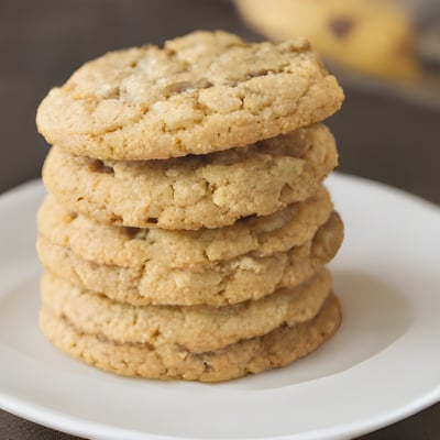 A stack of cookies sitting on top of a white plate