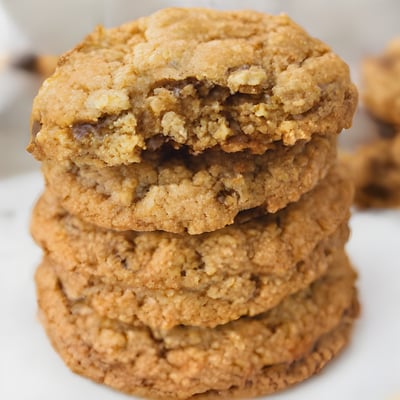 A stack of cookies sitting on top of a white plate
