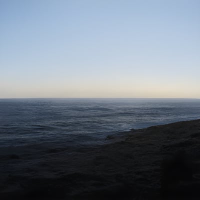 A beach next to the ocean