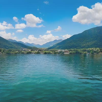 A body of water with mountains in the background