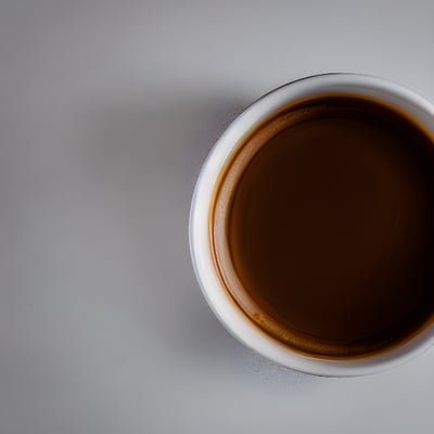 A cup of coffee sitting on top of a table