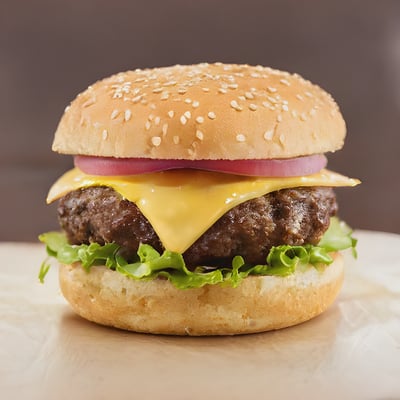 A hamburger with cheese and lettuce on a bun