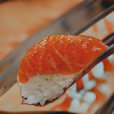 A piece of sushi with chopsticks sticking out of it
