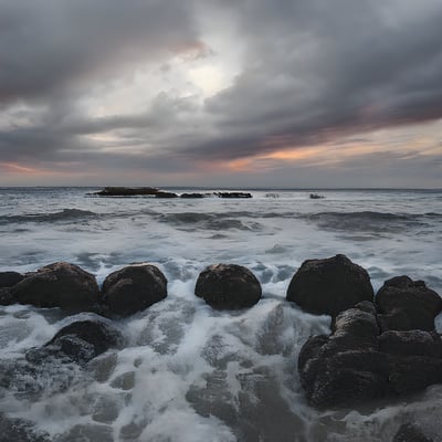 A rocky beach with waves coming in to shore