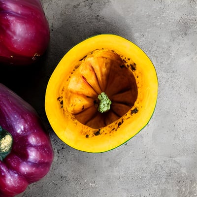 A group of vegetables sitting on top of a cement floor