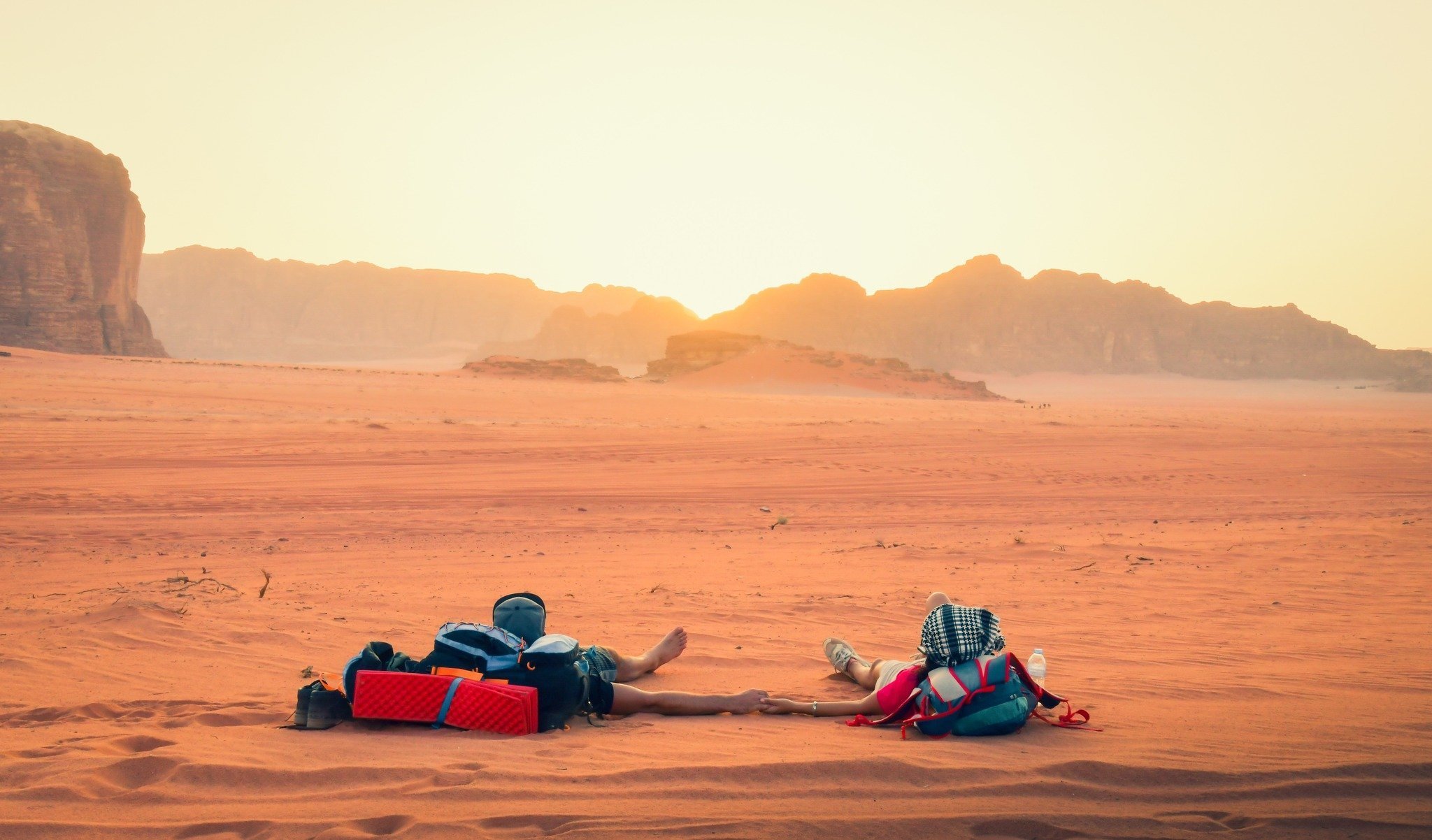 Tourists Laying Down In Wadi Rum