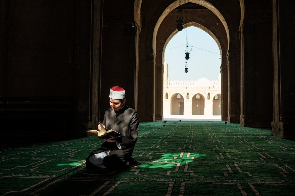 man praying in mosque in cairo egypt