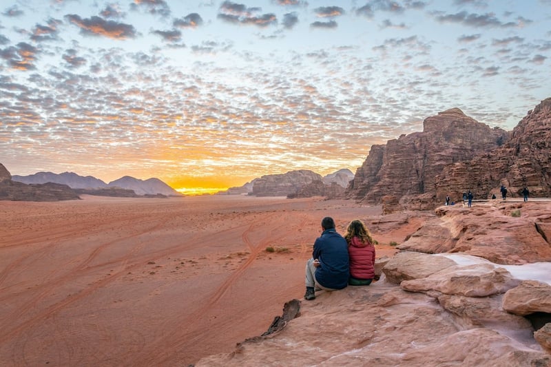 Tourists Admiring Sunset In Wadi Rum