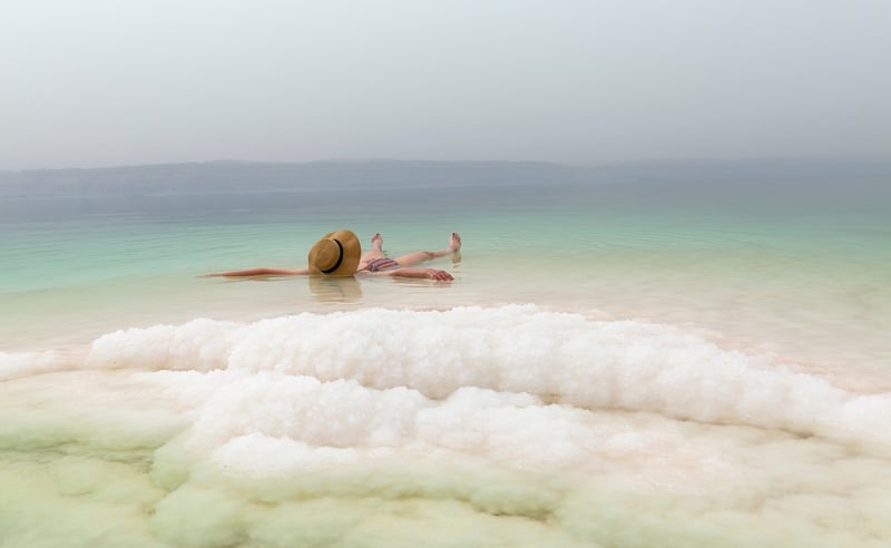 Tourist Floating In The Dead Sea Israel