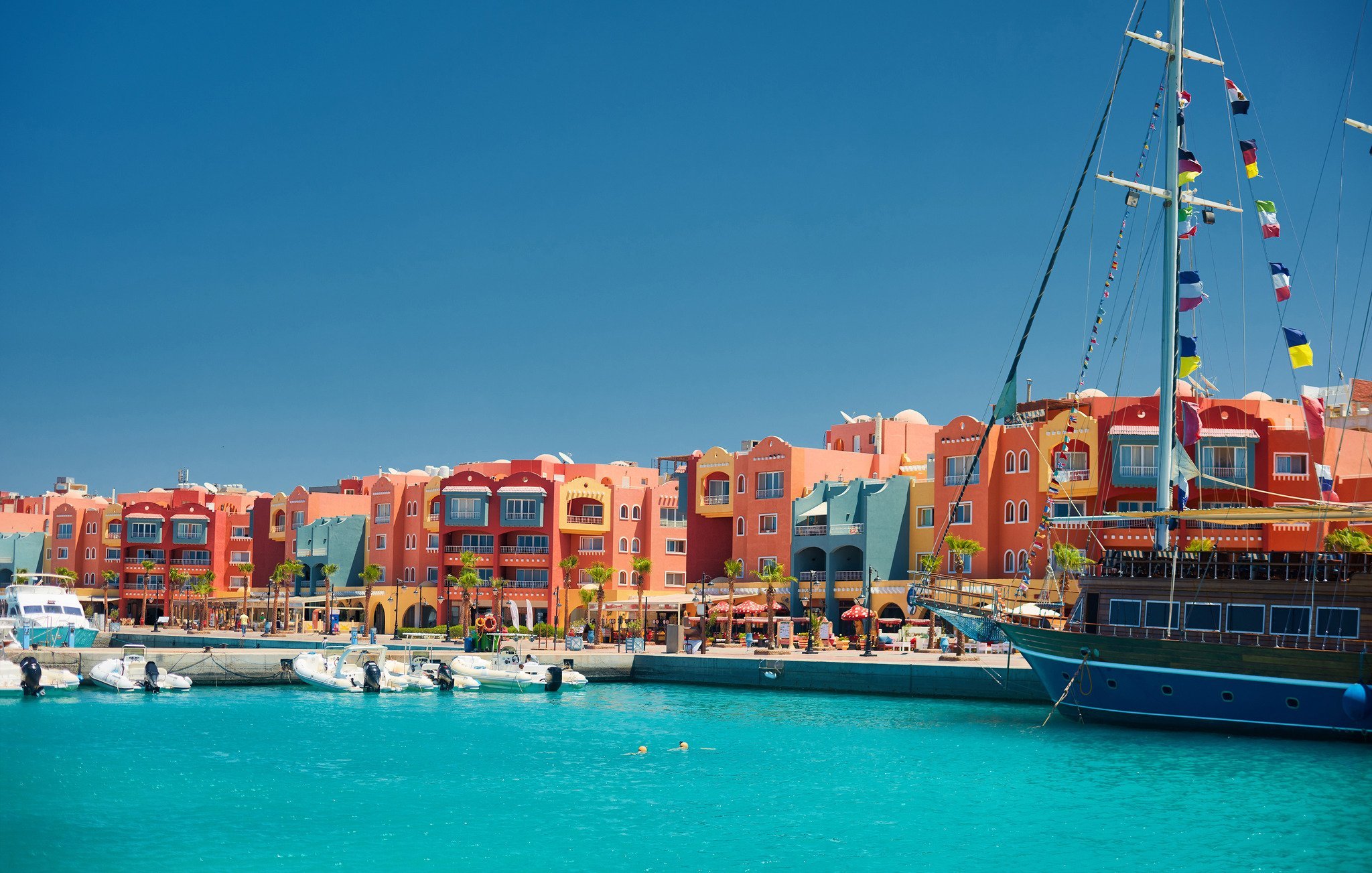 Panoramic View Of Boats In Hurghada Set Against Background Of Colorful Buildings