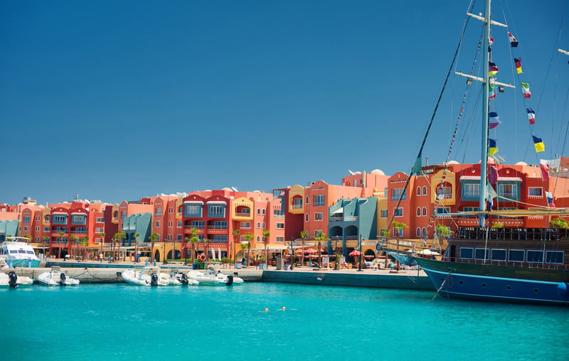Panoramic View Of Boats In Hurghada Set Against Background Of Colorful Buildings