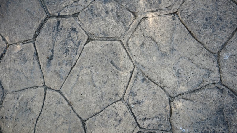Stamped concrete around a pool