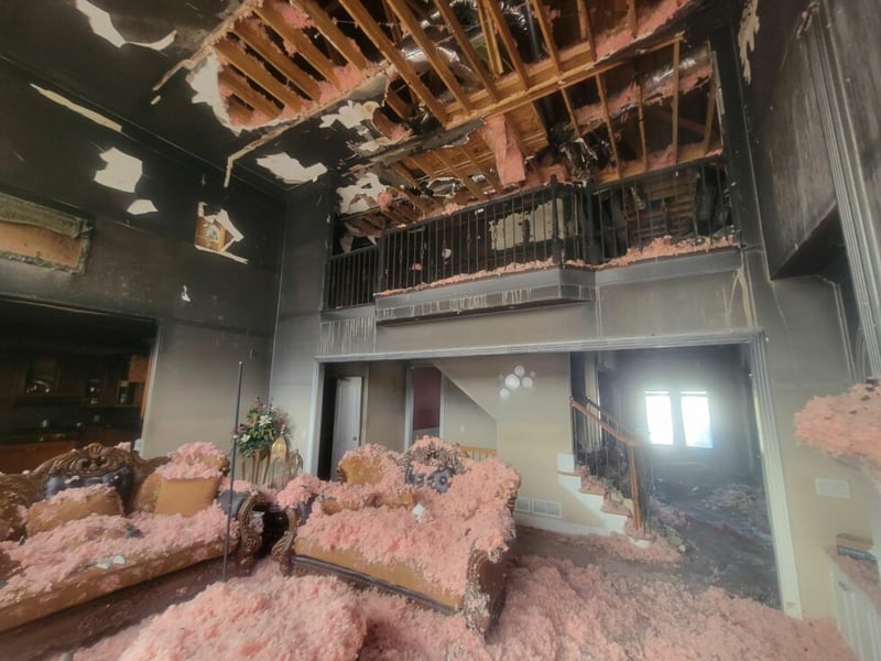 Team of environmental workers inspecting a commercial building for hazards.