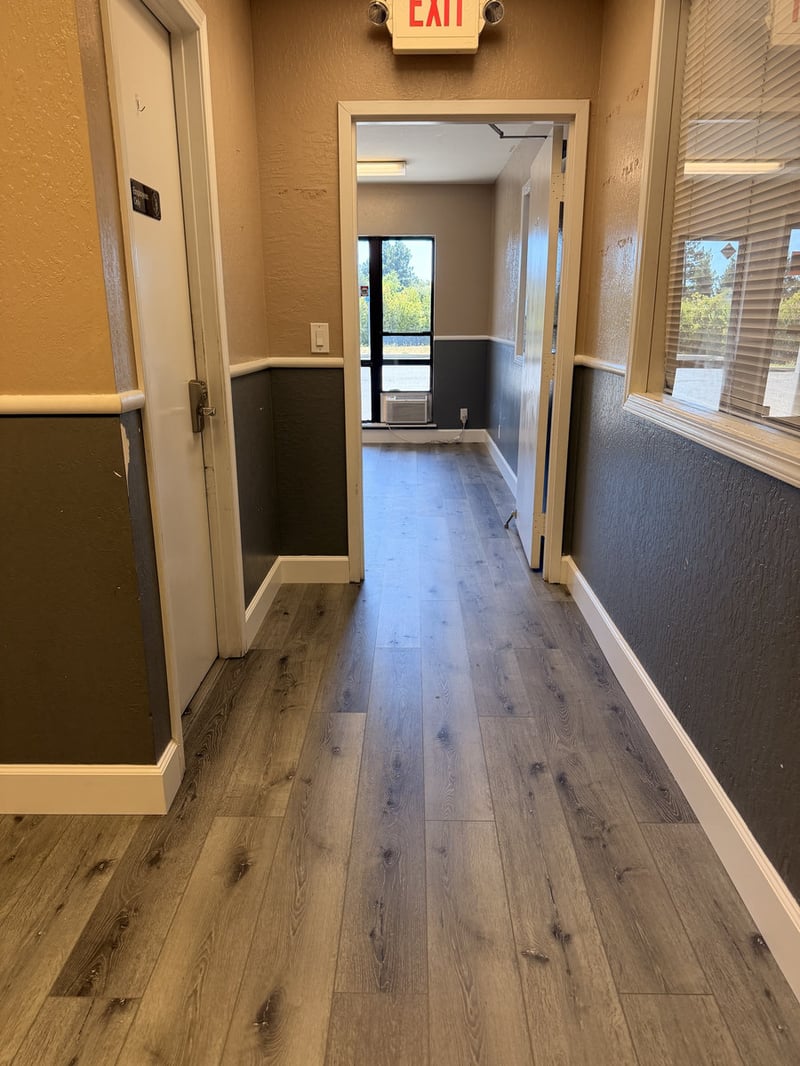 Waterproof vinyl plank flooring installed in a bright East Bay home