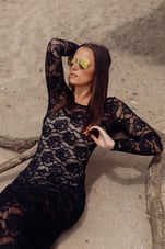 model-maria-relaxing-beach-in-lace-dress-and-sunglasses.jpg