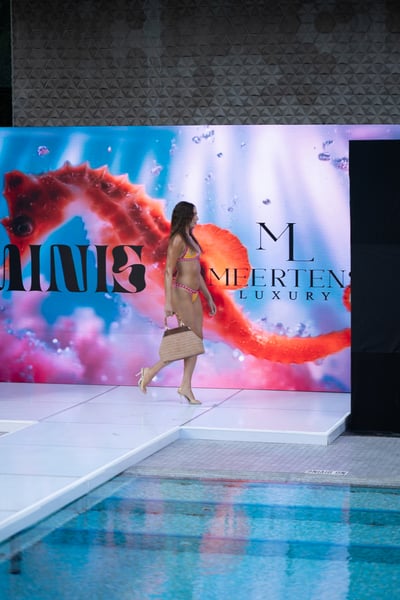 Swim Model Poses in Pink Patterned Cover-Up Dress