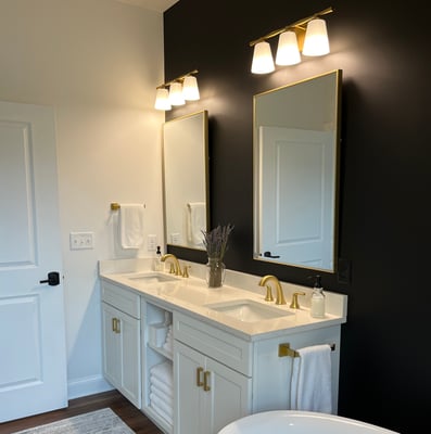 Bathroom 1 with double sinks and vanities.