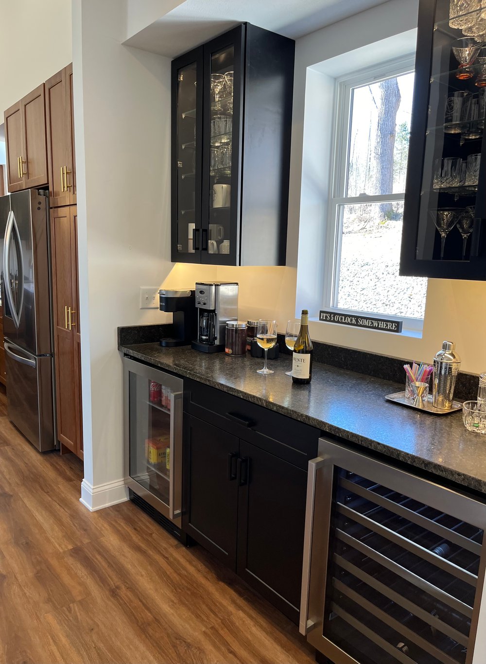 Bar adjacent to kitchen.
