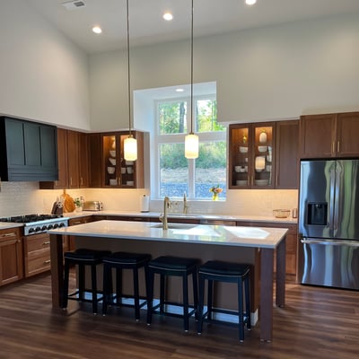 kitchen featuring a long island with four bar stools