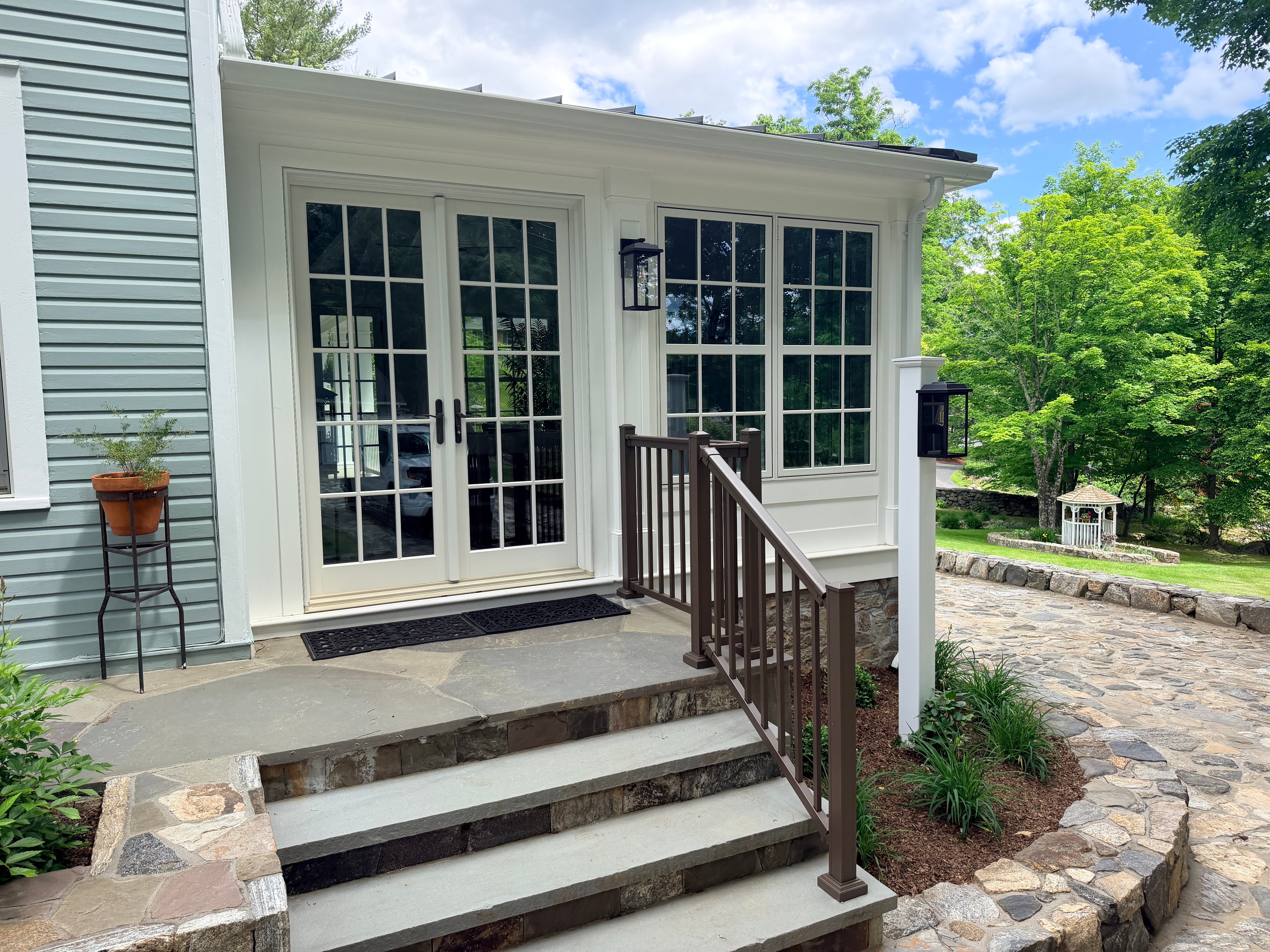 Somers sunroom — exterior entry steps and stone foundation