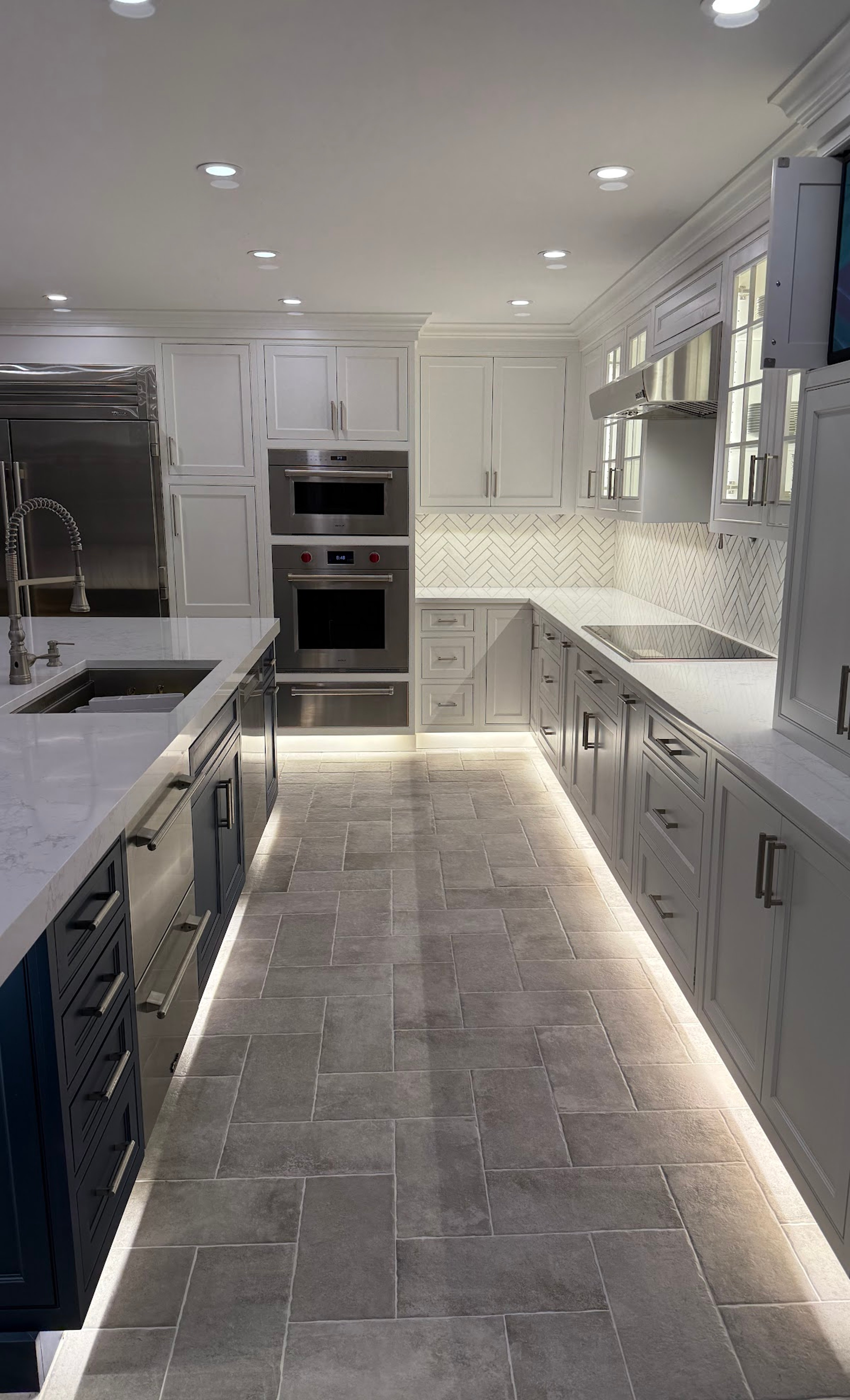 Yorktown kitchen — cabinetry, double oven, and herringbone backsplash