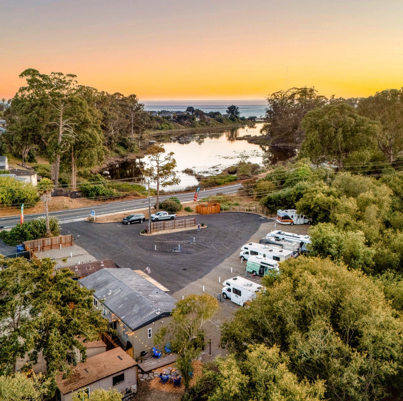 Aerial view of Beach&nbsp;RV Pleasure Point at golden hour, coast in the distance