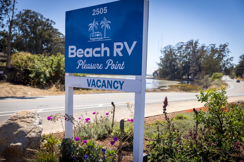 Beach RV Pleasure Point sign above the entrance garden