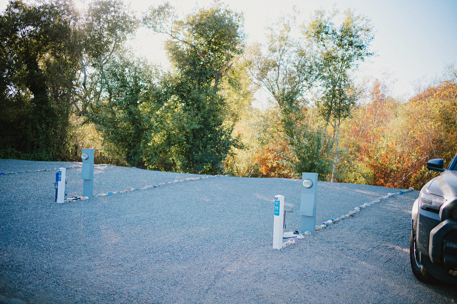 Full-hookup pedestals on empty Standard Plus pads framed by autumn trees