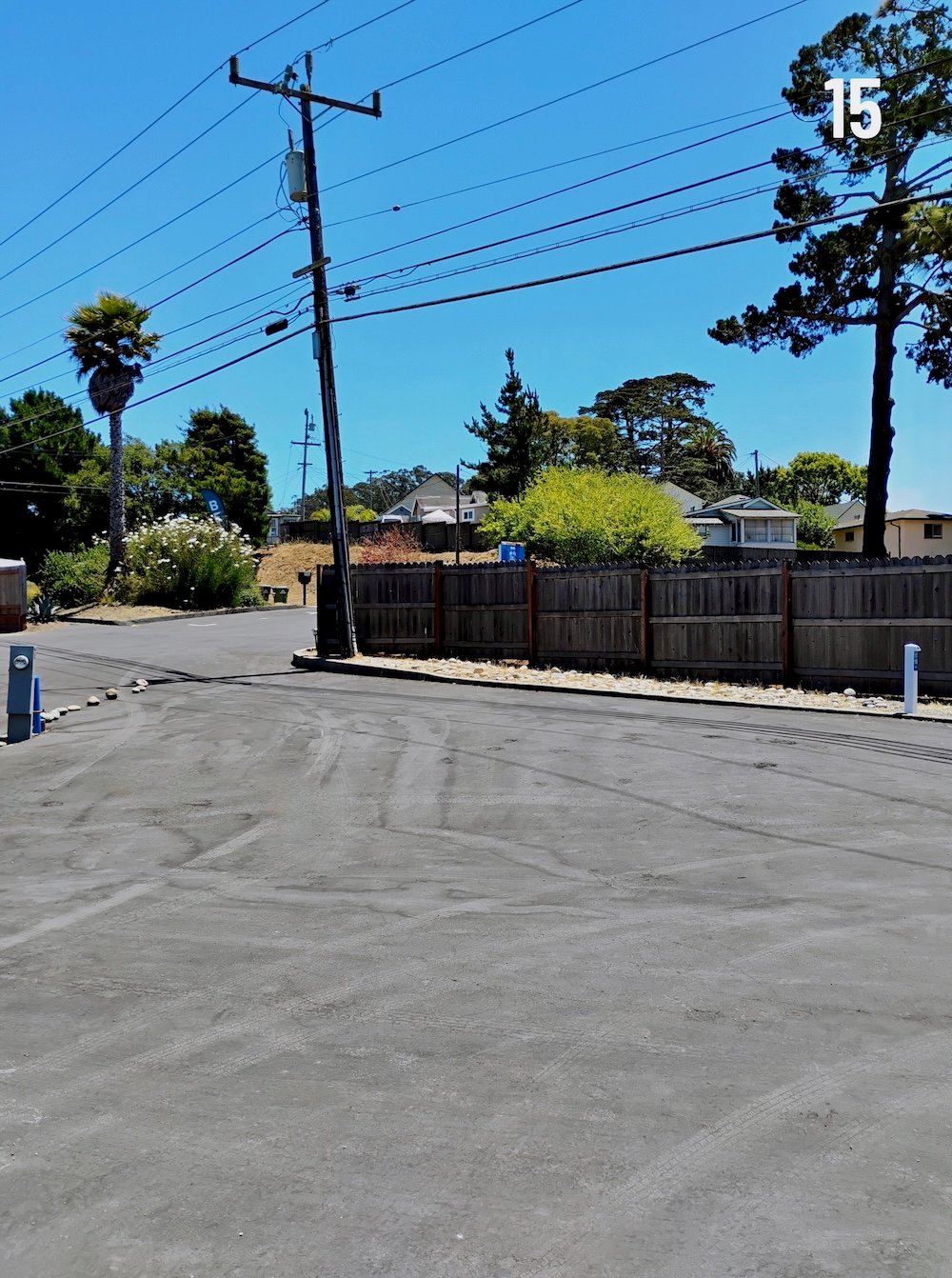 Empty site 15, the park's only paved pull-thru, with hookups alongside