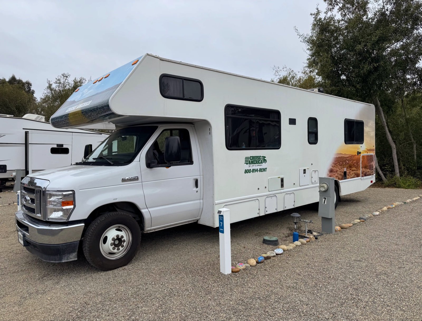 Class C motorhome on a Standard back-in gravel site at Beach RV Pleasure Point
