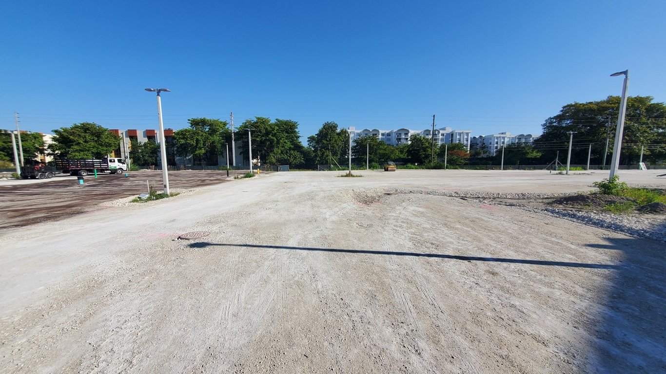 Leveled and compacted parking lot base before asphalt paving