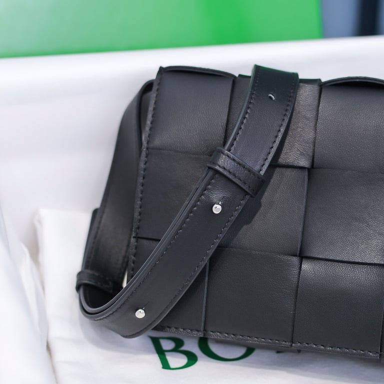 BOTTEGA VENETA BLACK CASSETTE INTRECCIATO LEATHER CROSS-BODY BAG
