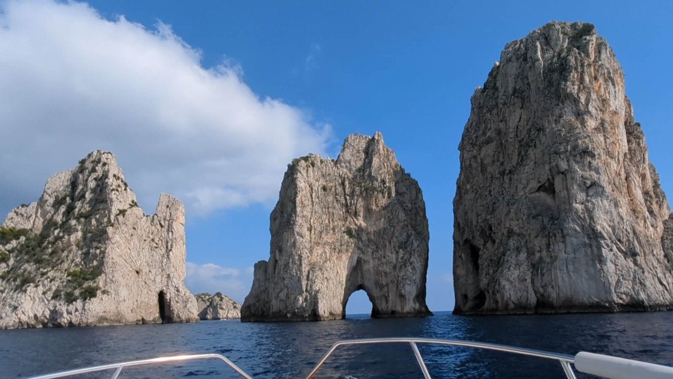 Faraglioni rocks with blue sky in the distance