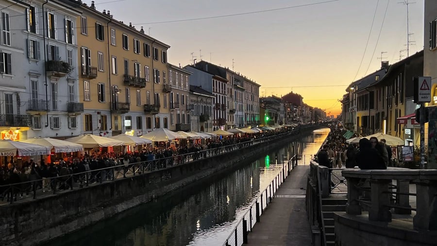 Milan Destination Guide: The Model of Fashion, Food, and Gothic Grandeur 2 Canal lined with restaurants at sunset in the Navigli neighbohood